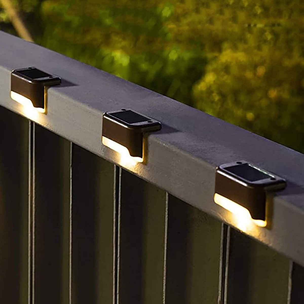 Supplier photograph of warm solar lights on a fence